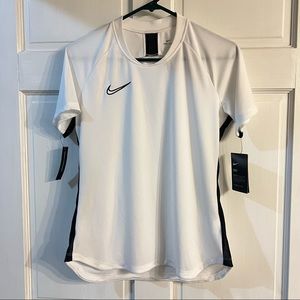 Women’s Nike Dri-fit short sleeve top. Longer in back for coverage.Size Medium.
